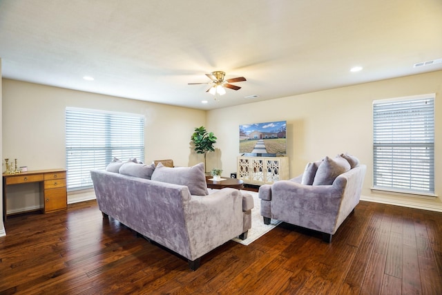 living room with ceiling fan, dark hardwood / wood-style flooring, and plenty of natural light