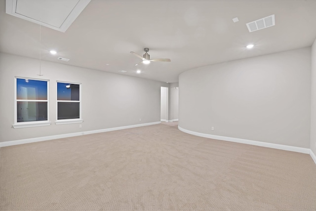 unfurnished room featuring ceiling fan and light colored carpet