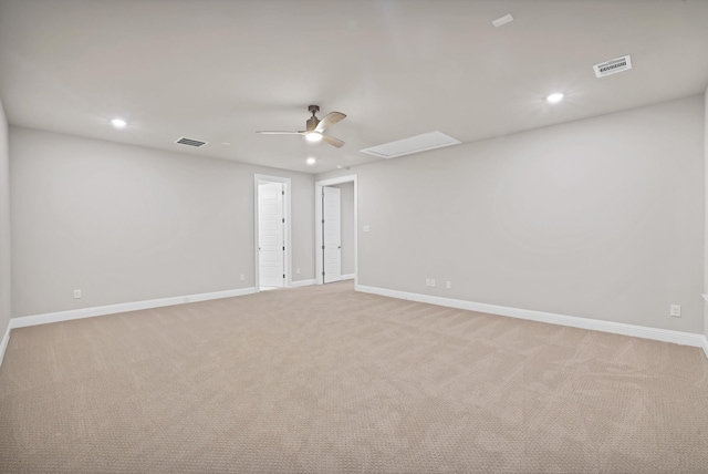 spare room with light carpet and ceiling fan