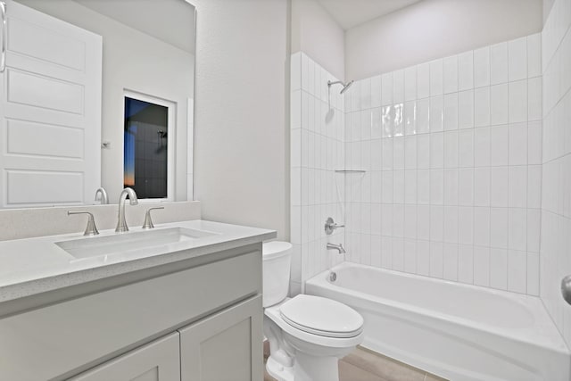 full bathroom featuring tile patterned floors, vanity, toilet, and bathtub / shower combination