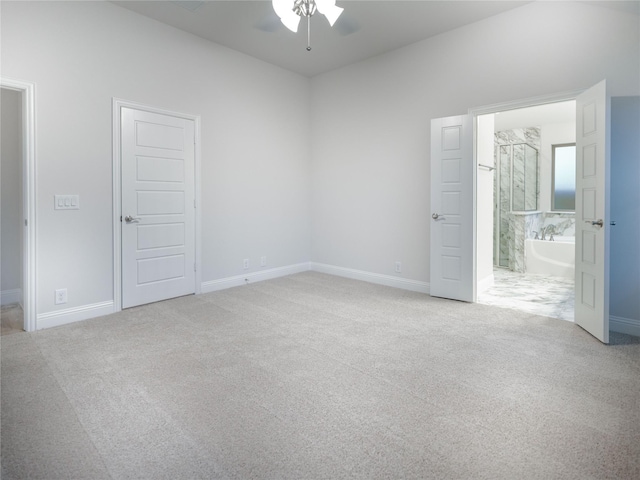 carpeted empty room featuring ceiling fan