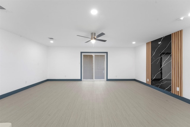 empty room with baseboards, visible vents, a ceiling fan, wood finished floors, and recessed lighting