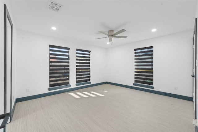 unfurnished room featuring recessed lighting, visible vents, ceiling fan, and baseboards