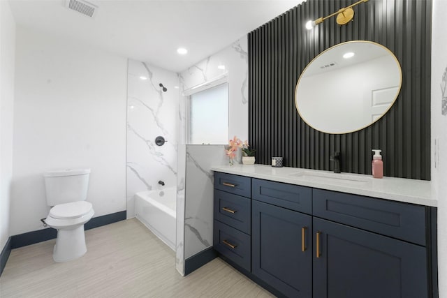 bathroom with baseboards, visible vents, toilet, vanity, and shower / bathtub combination