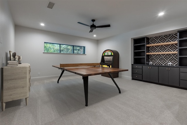 playroom featuring light colored carpet and ceiling fan