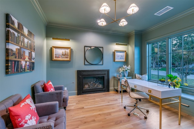 home office with hardwood / wood-style flooring, crown molding, and an inviting chandelier