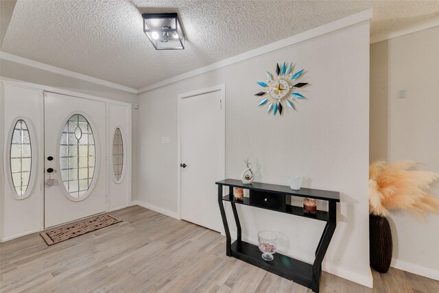 living room featuring a textured ceiling, light wood-type flooring, and wooden walls