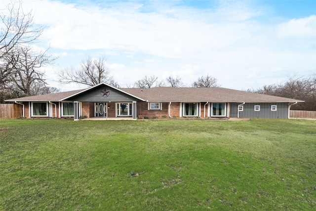 ranch-style home with a front lawn