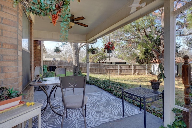 view of patio featuring a fenced backyard and a ceiling fan