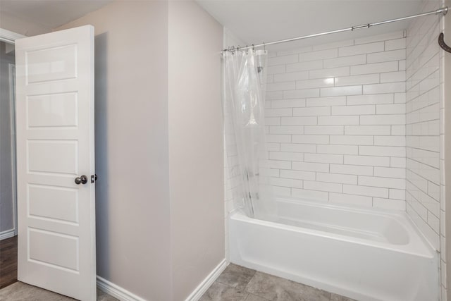 bathroom featuring tile patterned flooring and shower / tub combo