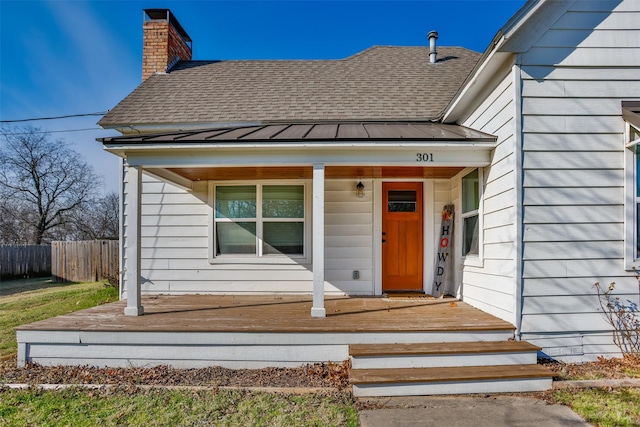 property entrance with covered porch