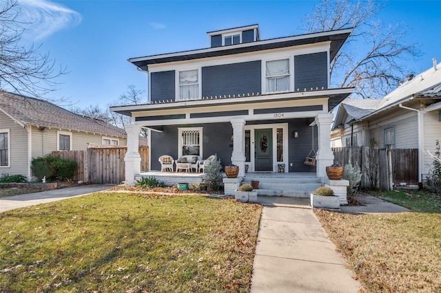 view of front facade featuring a porch and a front lawn