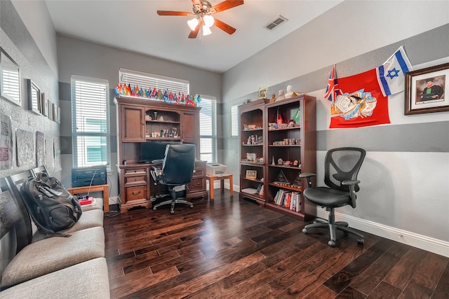 home office with dark wood-type flooring and ceiling fan