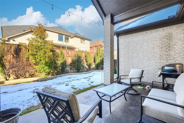 view of snow covered patio