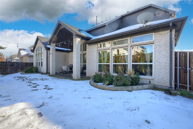 view of snow covered house