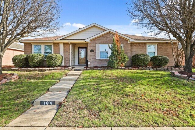 ranch-style house featuring a front lawn