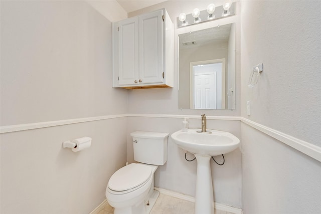 bathroom with sink and toilet