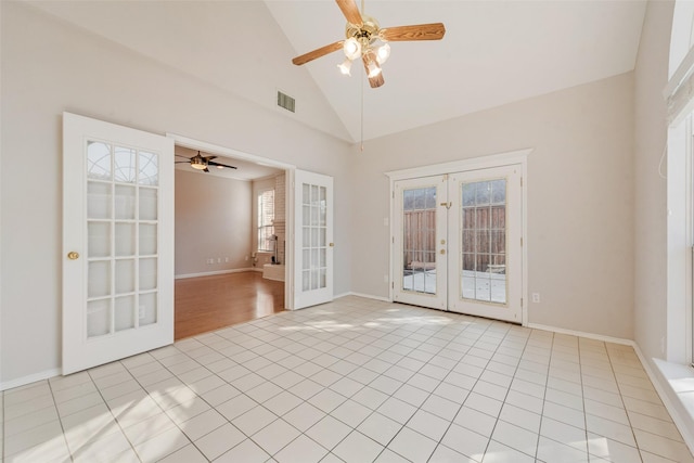 empty room featuring french doors, ceiling fan, high vaulted ceiling, and light tile patterned floors