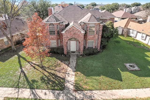 view of front facade with a front lawn