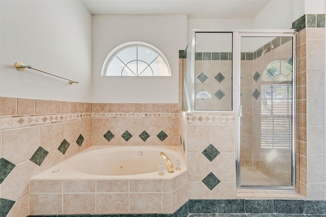 bathroom with tile walls and plus walk in shower