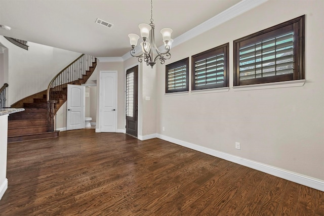 unfurnished dining area featuring ornamental molding, a notable chandelier, and dark hardwood / wood-style flooring