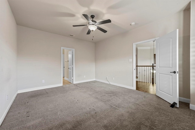 spare room with ceiling fan and carpet flooring