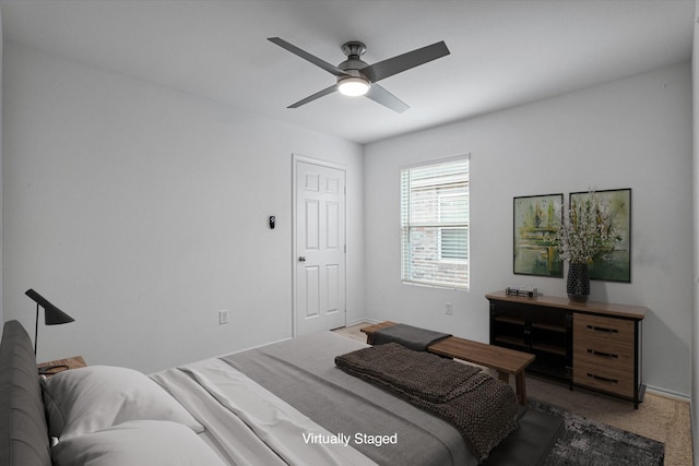 carpeted bedroom with ceiling fan