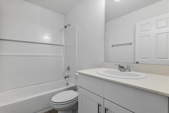 full bathroom featuring toilet, vanity, and bathing tub / shower combination