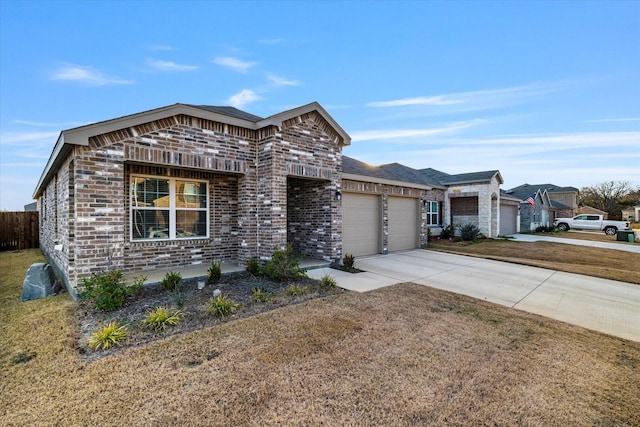 view of front of home featuring a garage and a front yard