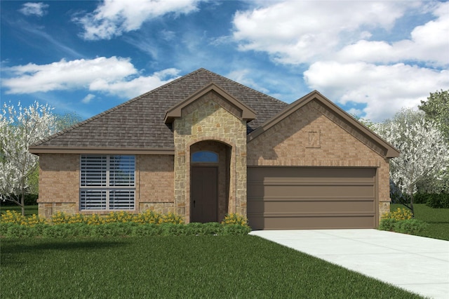 view of front of house featuring a garage and a front lawn