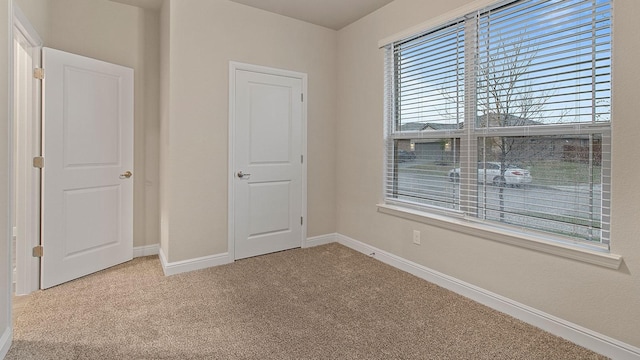 unfurnished bedroom featuring carpet flooring