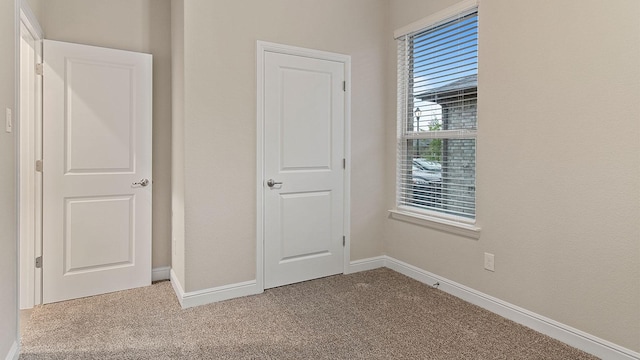 unfurnished bedroom featuring carpet floors