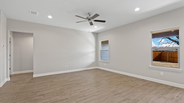 unfurnished room with ceiling fan and light hardwood / wood-style flooring