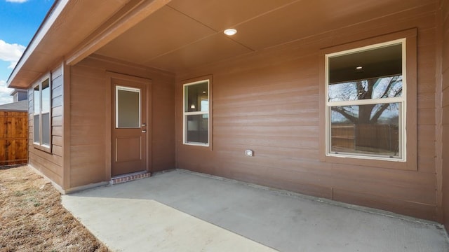 property entrance featuring a patio area