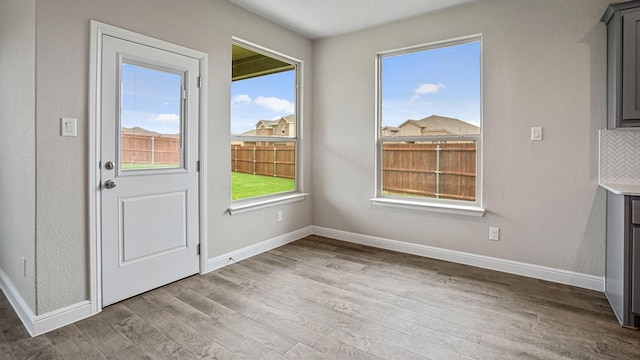 unfurnished dining area with hardwood / wood-style flooring