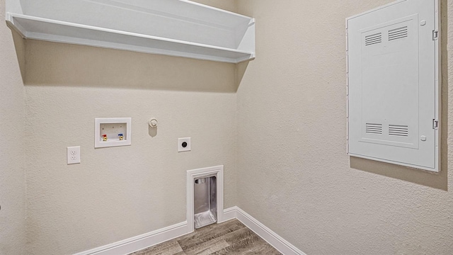 clothes washing area featuring hookup for a gas dryer, hookup for a washing machine, hardwood / wood-style flooring, and hookup for an electric dryer