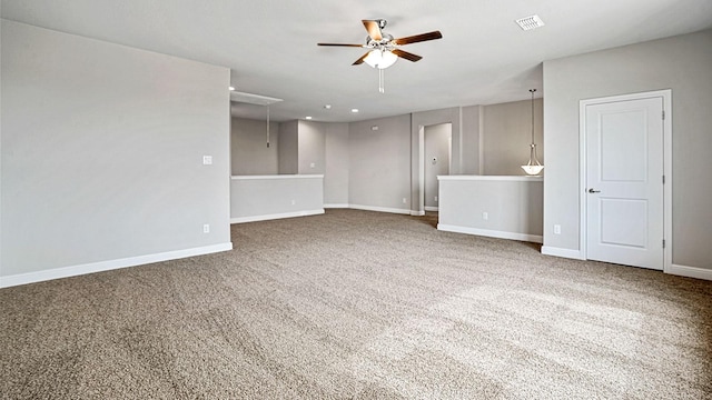 interior space featuring carpet flooring and ceiling fan