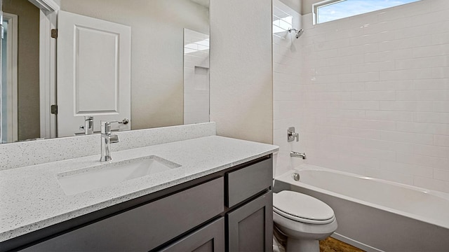 full bathroom featuring vanity, shower / bath combination, and toilet