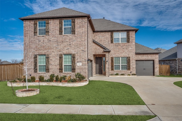 view of front facade featuring a garage and a front lawn