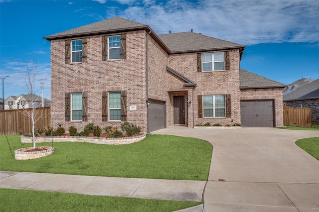 view of front of house featuring a garage and a front yard