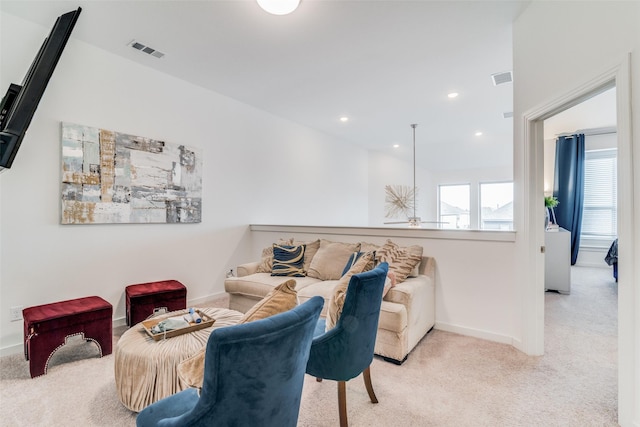 living room featuring light carpet