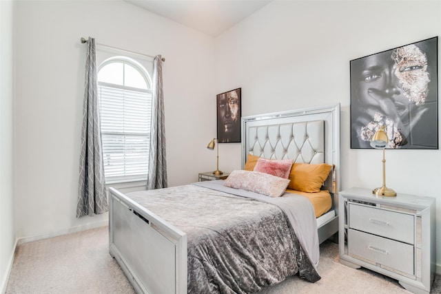 bedroom with light colored carpet