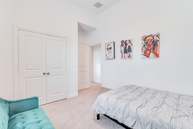 carpeted bedroom featuring a closet