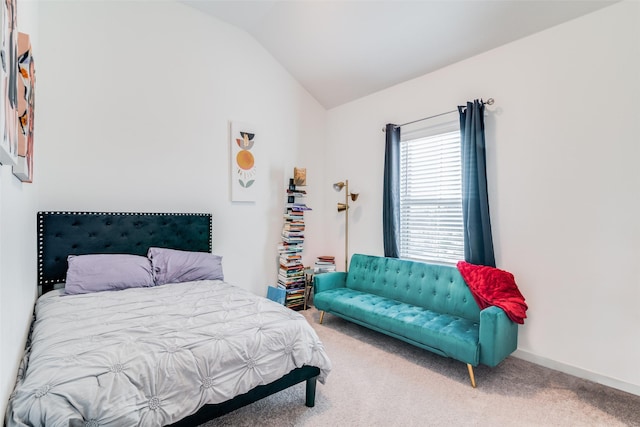 carpeted bedroom featuring vaulted ceiling