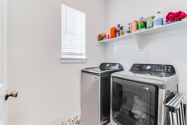 clothes washing area featuring independent washer and dryer