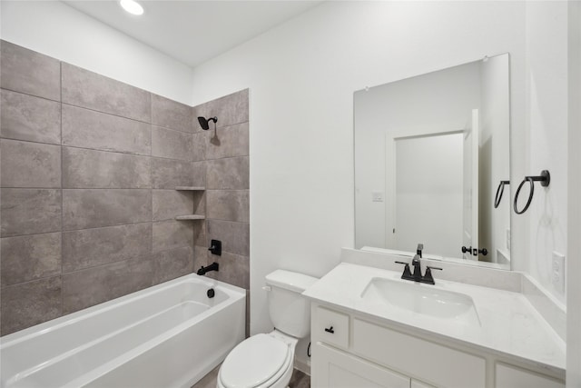 full bathroom featuring vanity, toilet, and tiled shower / bath combo