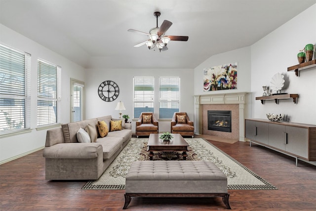 living room featuring dark wood-type flooring and ceiling fan