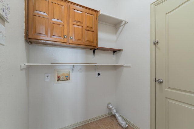 laundry area with hookup for an electric dryer, light tile patterned flooring, cabinets, and hookup for a washing machine