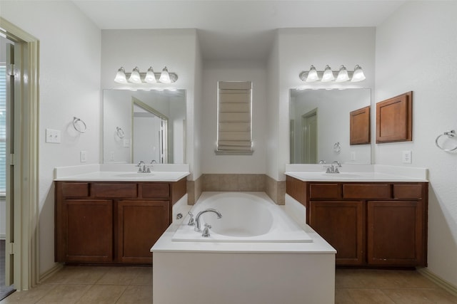 bathroom featuring a tub, tile patterned flooring, and vanity