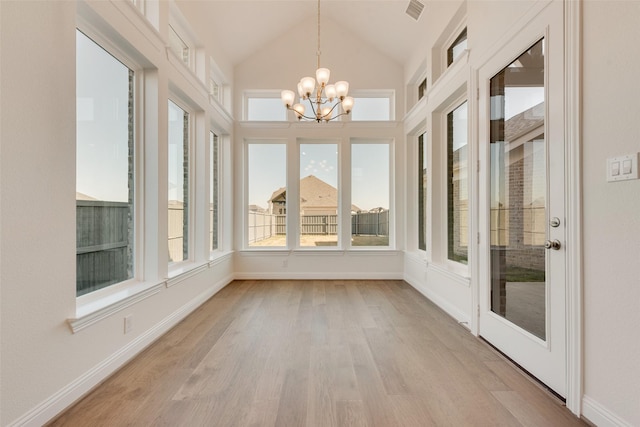3542 Coneflower Trl, Prairie Ridge, TX 76084 - unfurnished sunroom featuring wood finished floors, a chandelier, vaulted ceiling, and baseboards